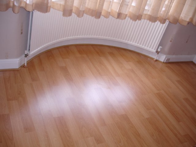 Curved Beading Under Radiator With, Pictures Of Laminate Flooring With Beading